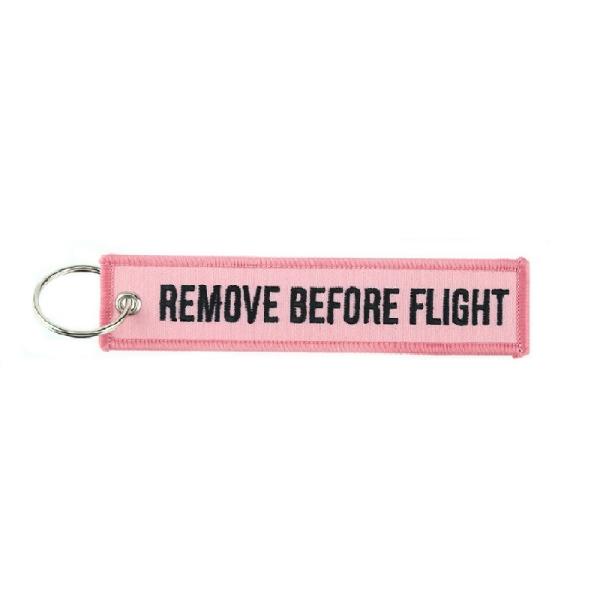Schlüsselanhänger REMOVE BEFORE FLIGHT pink